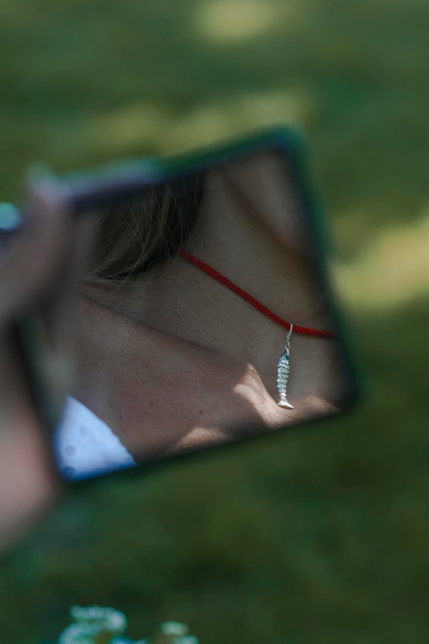 Emerald Eye Fish Pendant