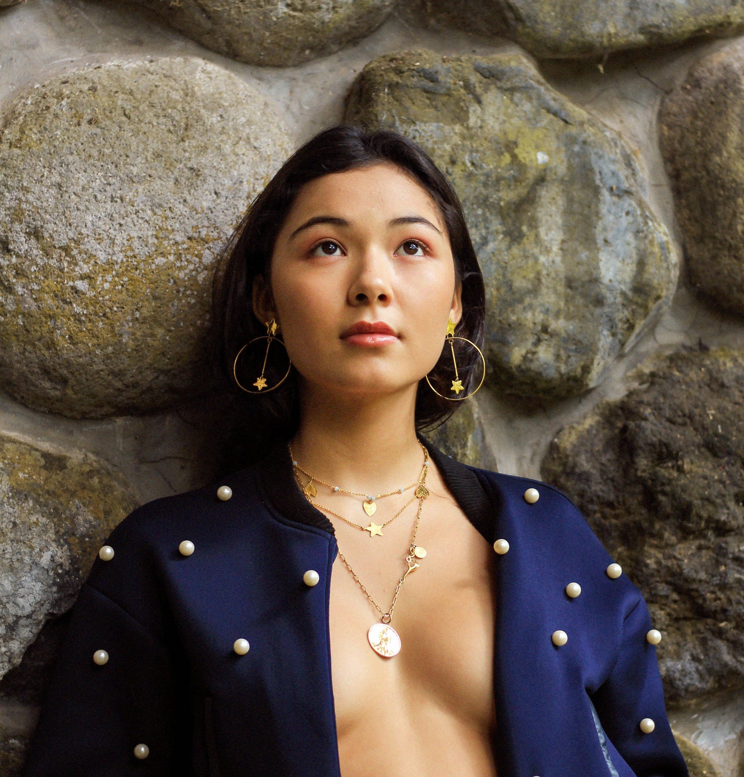 gold necklaces on model
