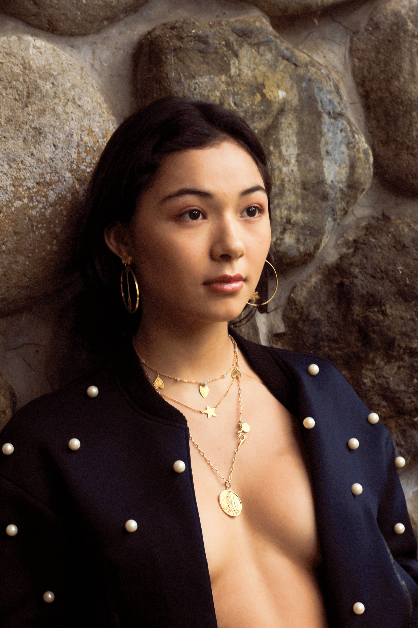 gold necklaces layer on model