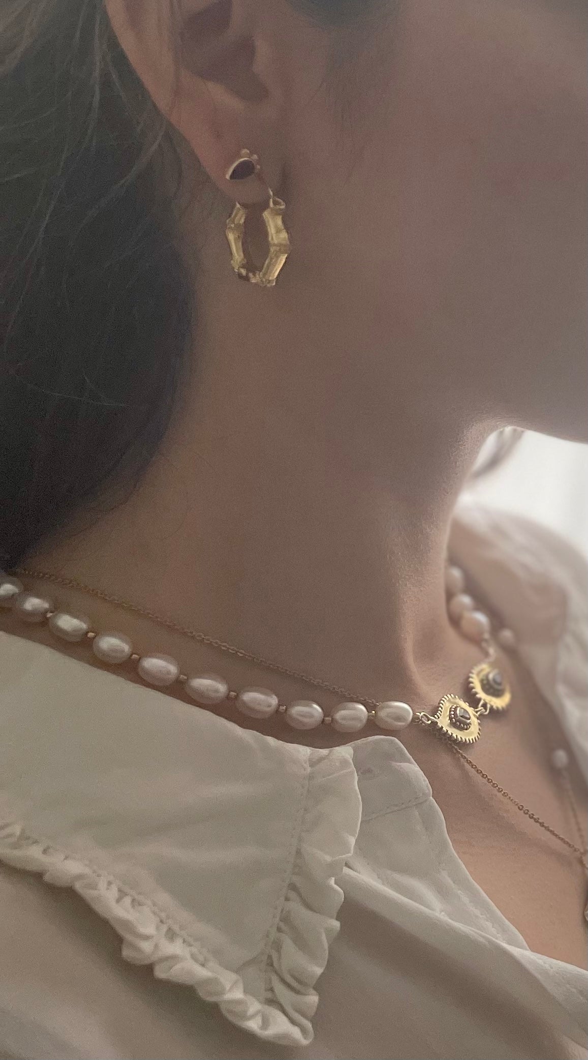 Mystic Bamboo Earrings close up on model