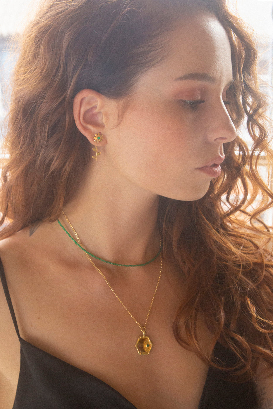 gold flower studs earrings campaign photo