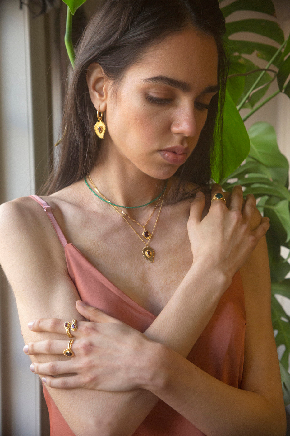 garnet drop earrings on model