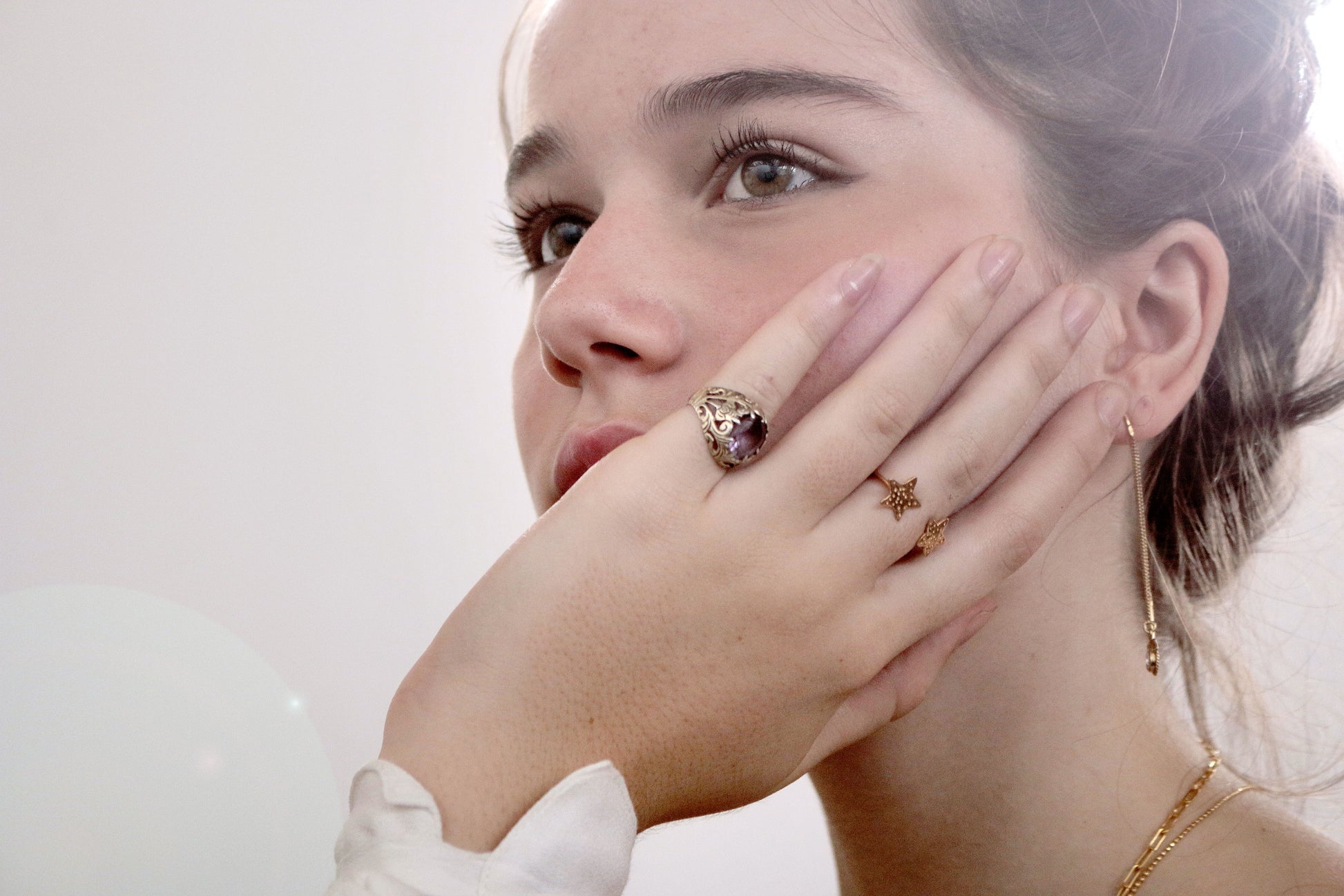 gold ring with stars on model