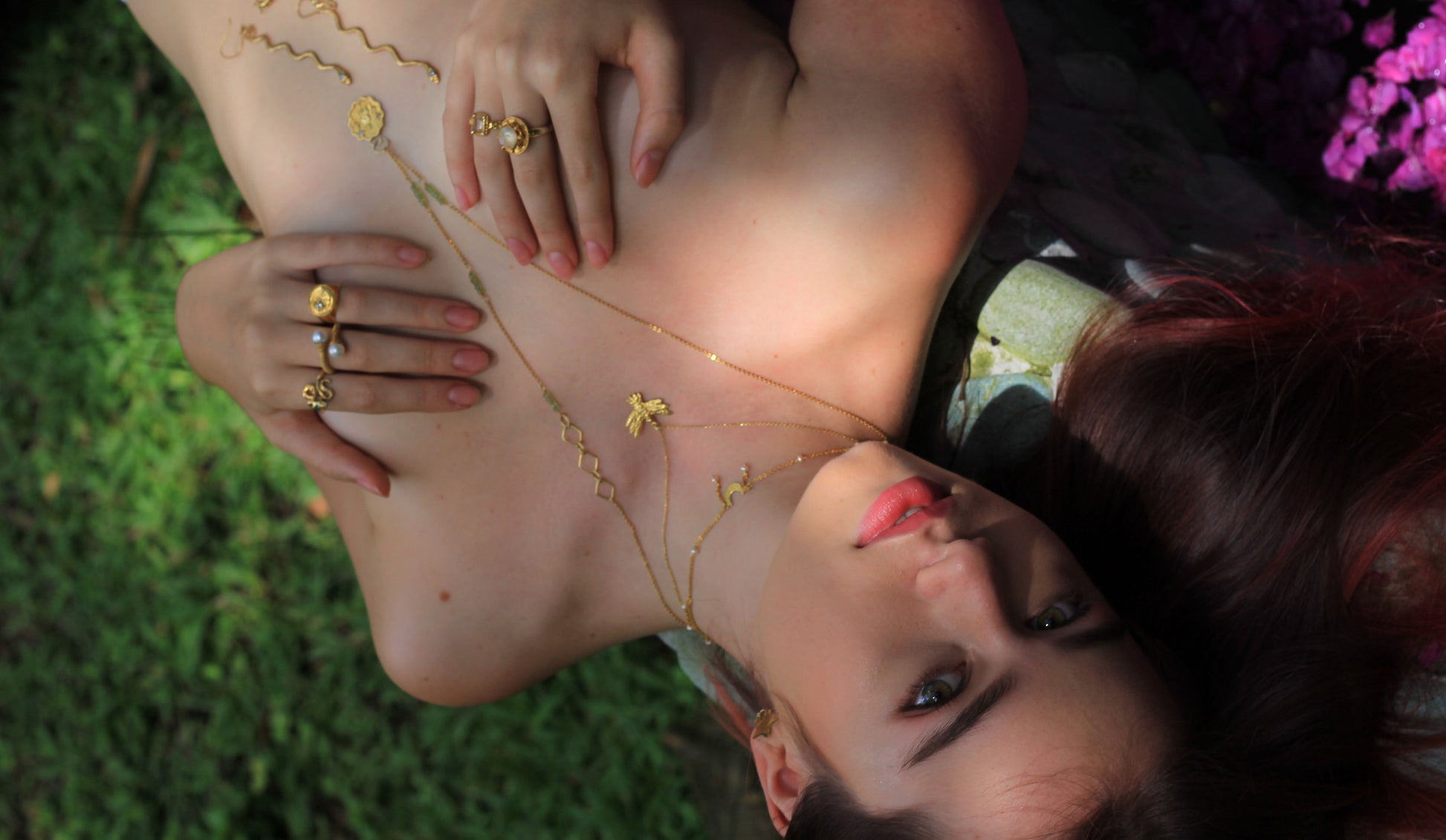 Handmade gold necklaces on model