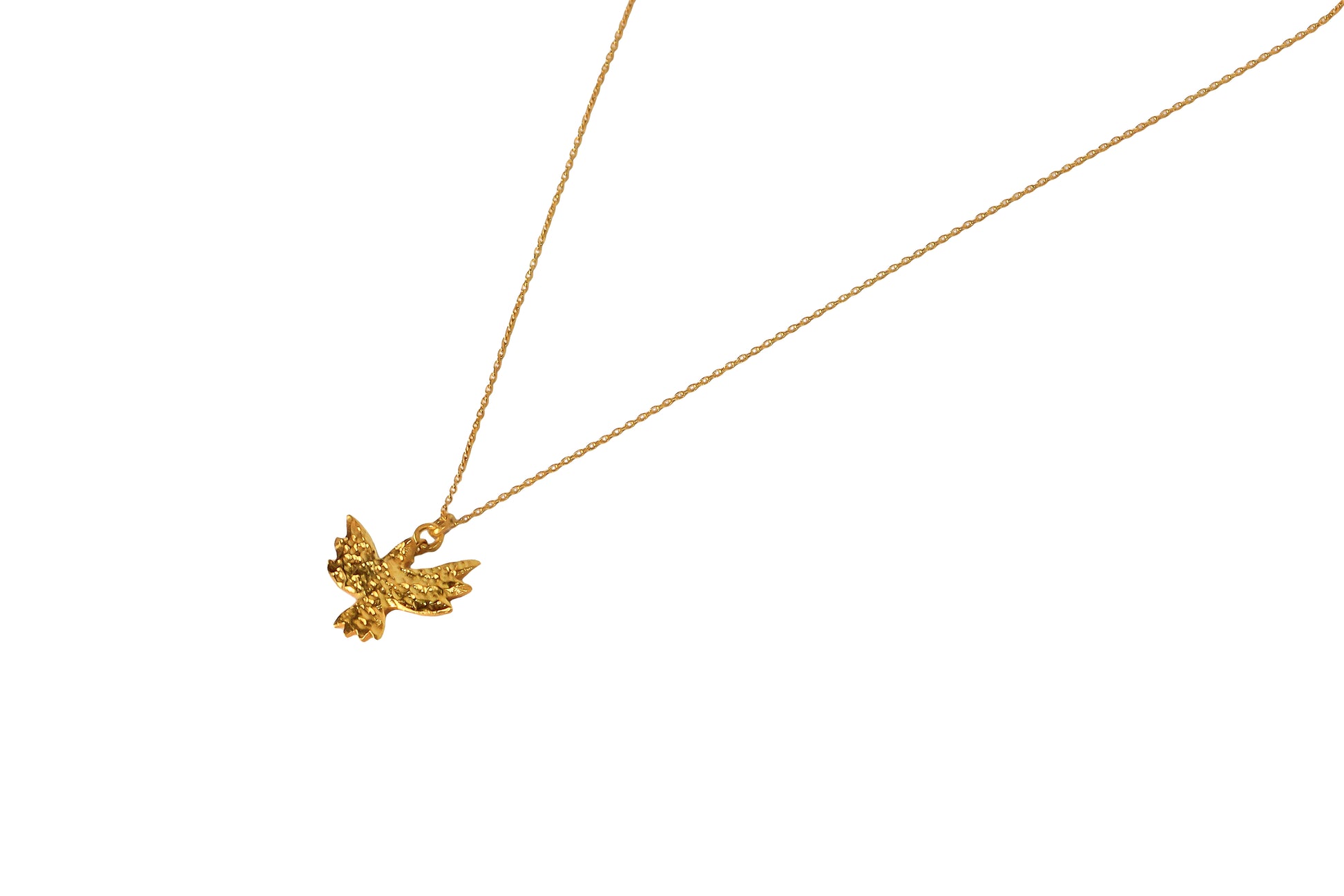 Bird gold necklace close up