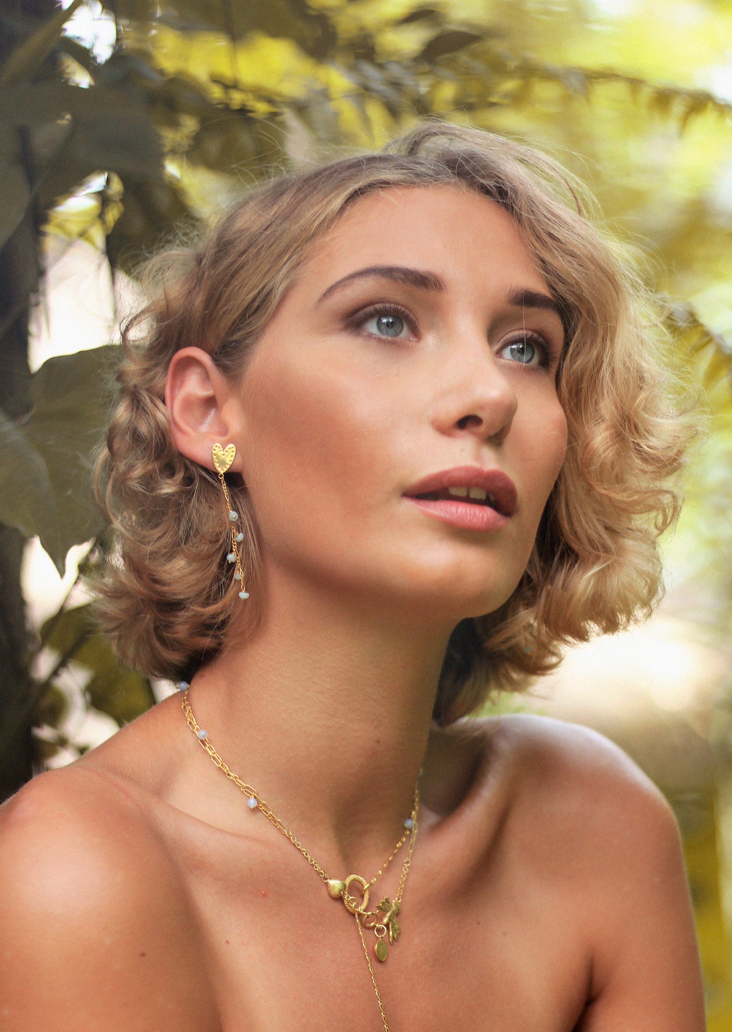 gold layers of jewellery on model